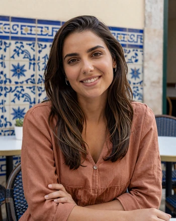 Inês, 28, Portuguese woman from Lisbon sitting at an outdoor café in the Alfama district