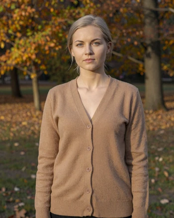 Justina, 34, Lithuanian woman from Šiauliai in autumn park setting with serene expression