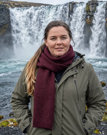 Sólveig, 33, Icelandic woman from Akureyri near Goðafoss waterfall with dramatic mist in background