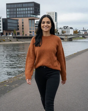 Mia, 27, German woman from Düsseldorf walking along the Rhine promenade